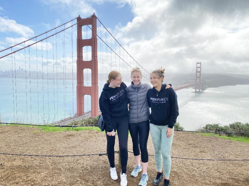 Rachael between two other young women founders with the Golden Gate Bridge behind her