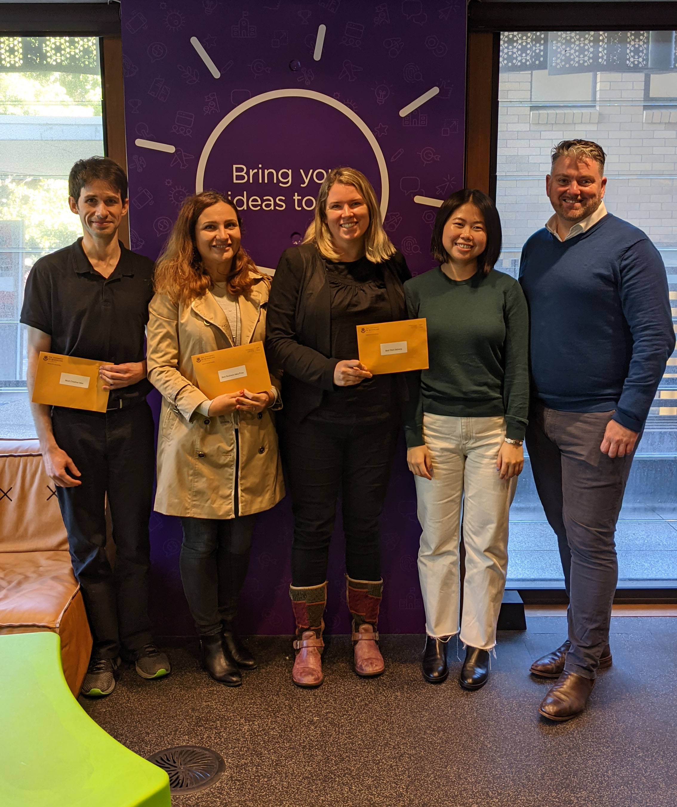 Curiosity PhD Winners 2021 holding awards