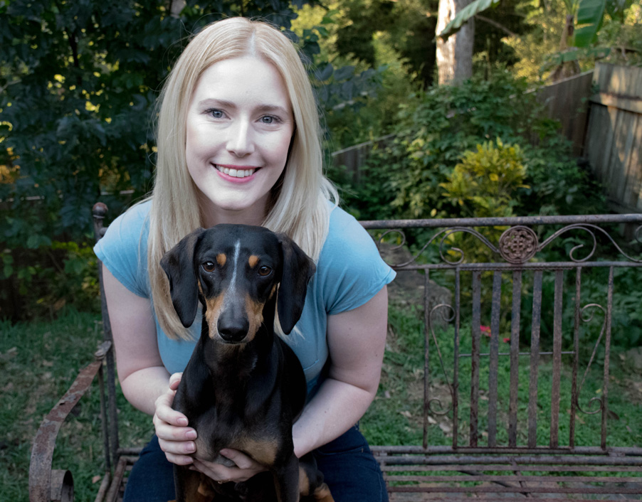 Zoe holding her foster dog Flex