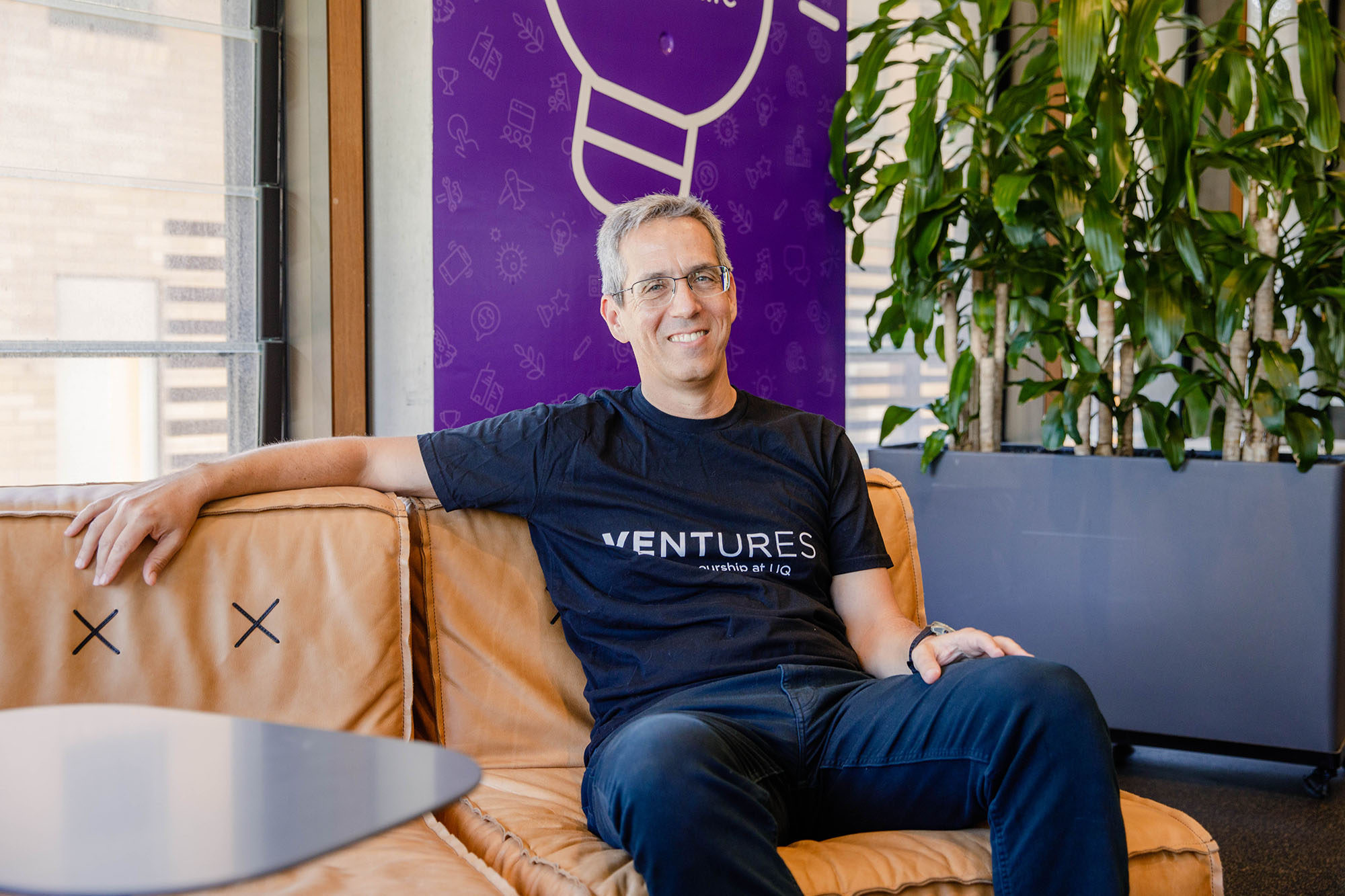 Nimrod Klayman sitting on couch in Ventures GCI space 
