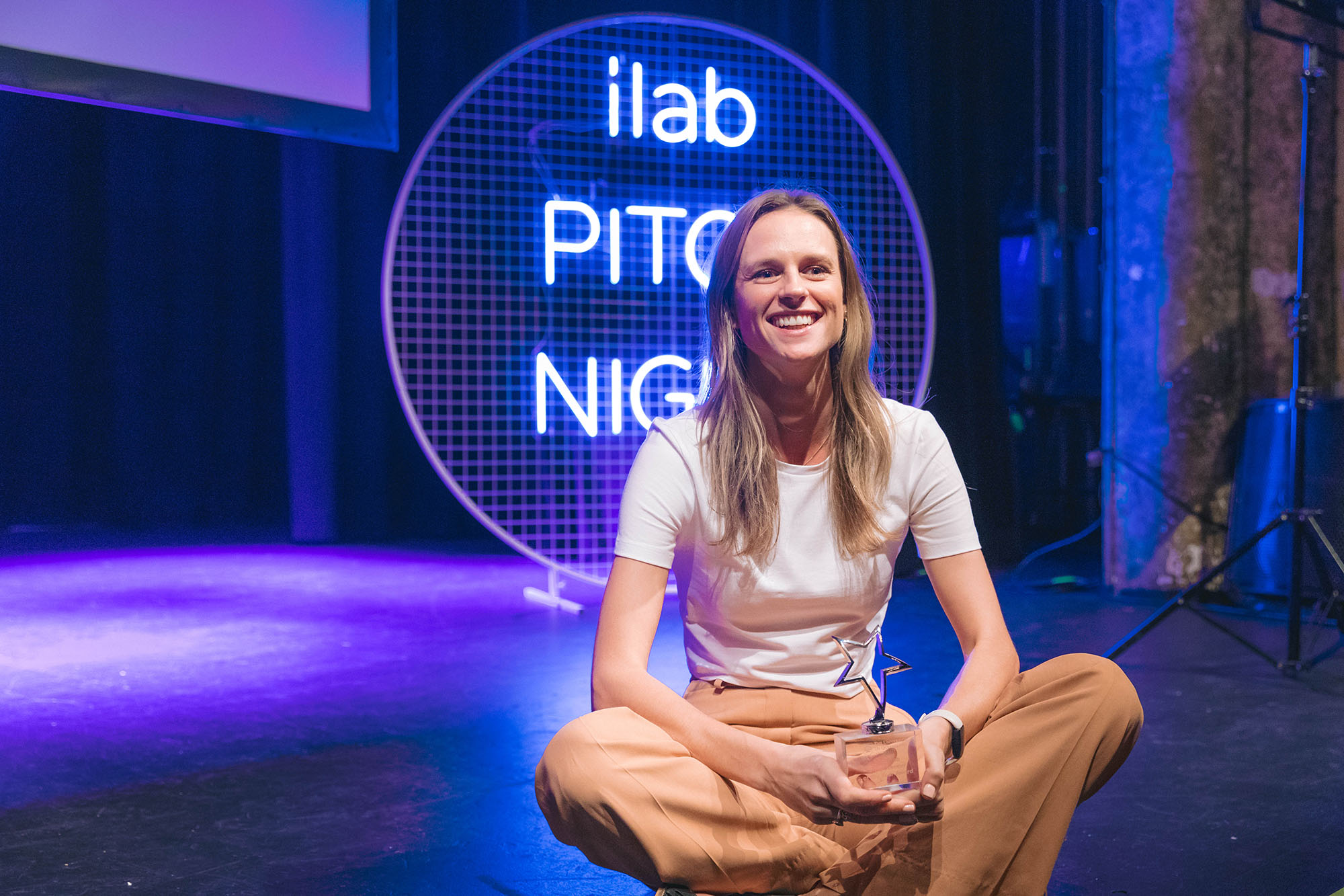 Siobhan Coster sitting on stage at Pitch Night