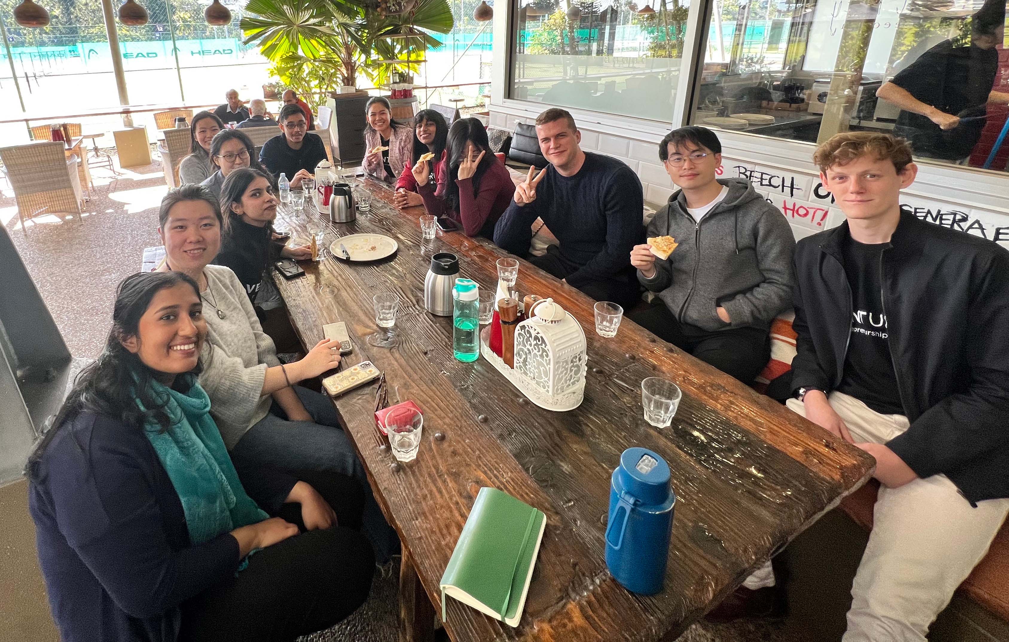 Startup AdVenturers seated at long table at networking lunch