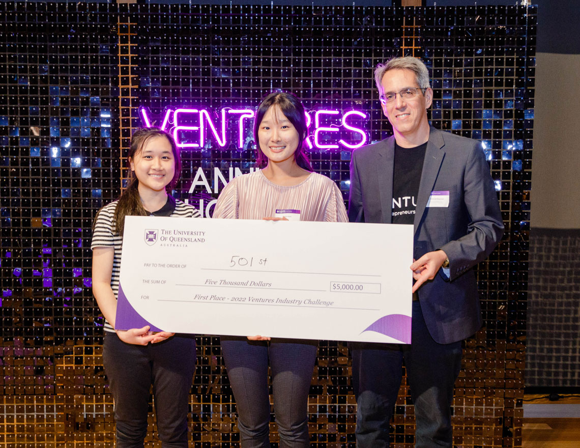 Caitlin and Kelly with Nimrod on stage at the Annual Showcase