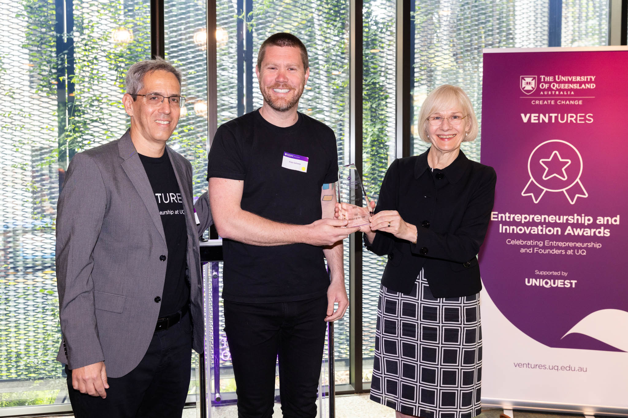 Andy Galloway holding his award