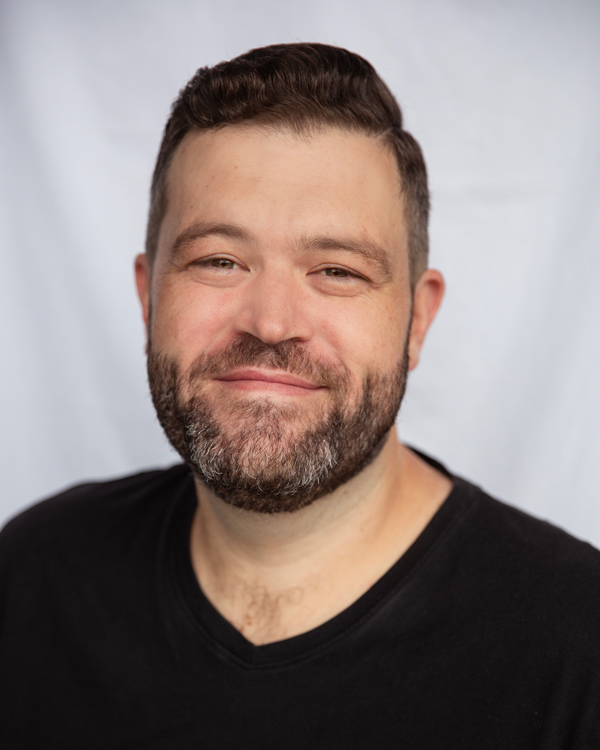 Michael Cotton headshot - full beard and short hair