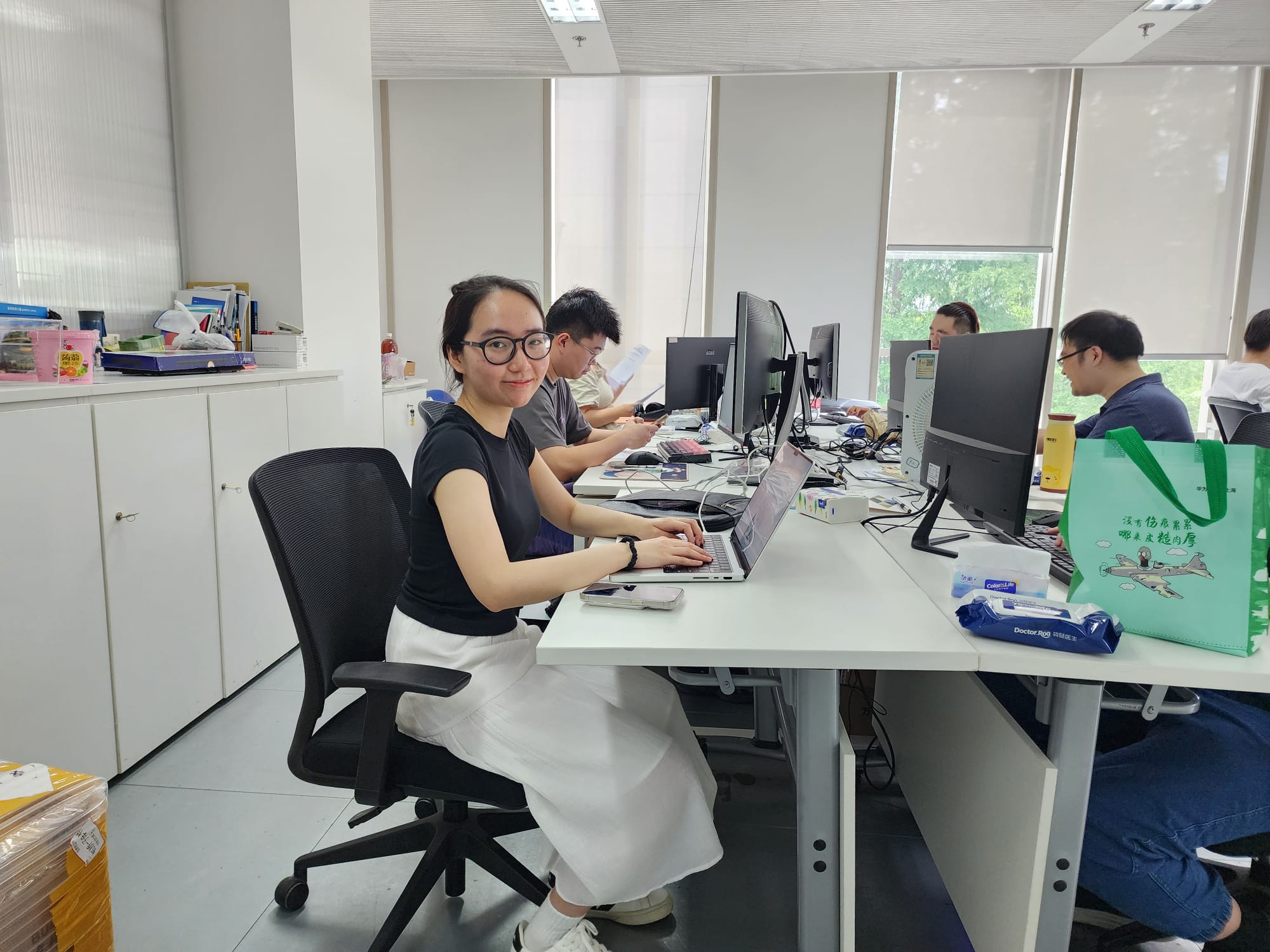 student interning in shanghai open plan office space