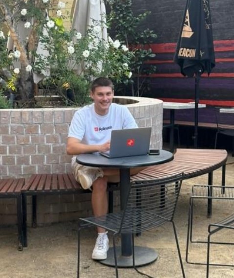 Student using laptop in a public space