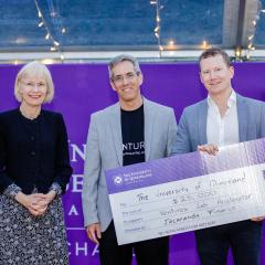 UQ Vice-Chancellor Professor Deborah Terry AO, Head of Entrepreneurship Nimrod Klayman and 2.	Daniel Wessels, CEO of Jacaranda Finance holding novelty sized UQ Giving Day cheque
