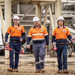 co-founders wearing high visibility and hard hats on a mining site