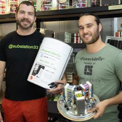 Nicholas and Brad holding up powerwells prototype