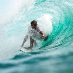 surfer in a barrel