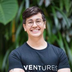 ilab founder Roger wearing his Ventures tshirt (name on black) in front of green wall