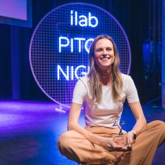 Siobhan Coster sitting on stage at Pitch Night