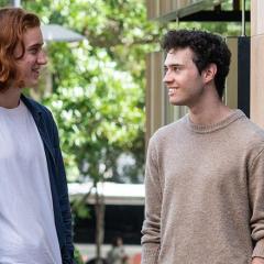 Jack Anderson And Tom Bizzell looking at each other 