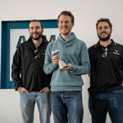 Valiant Space standing with their product in hand
