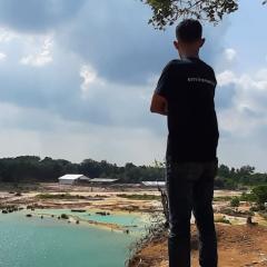 person surveying mining site 