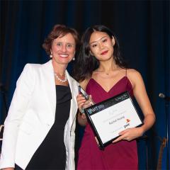 Rachel holding award