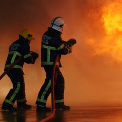 Firefighters taking out a fire