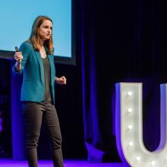 Camille Socquet-Clerc on stage presenting at pitch night