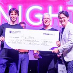 MyHive winners holding cheque with Tyson Jennings