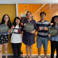 startup adventures standing and holding signs 
