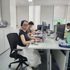 student interning in shanghai open plan office space