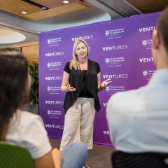 Woman talking in front of audience