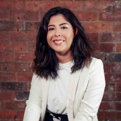 Headshot of Vanessa Murillo in front of brick wall