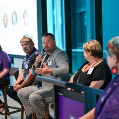 People talking on a panel