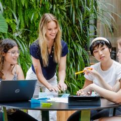 Women sitting around a table brainstorming