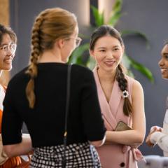 Women talking in a group at a function