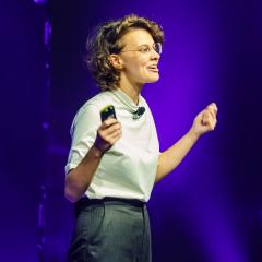 Woman pitching on stage