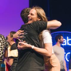 Siobhan hugging Ventures program officer on stage