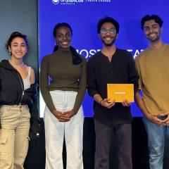 Group students awarded prize in front of tv screen