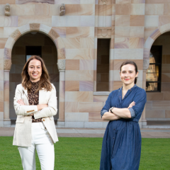 UQ women standing proudly in front of UQ's Great Court