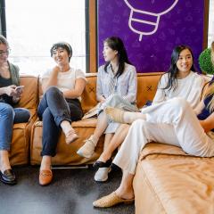 Women sitting and talking on couches in Ventures Space