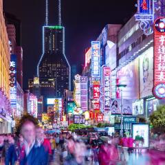 busy shanghai street with neon lights